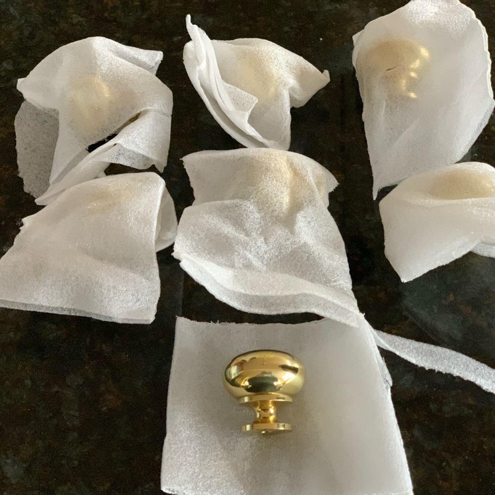A set of six heavy brass knobs - new with tags